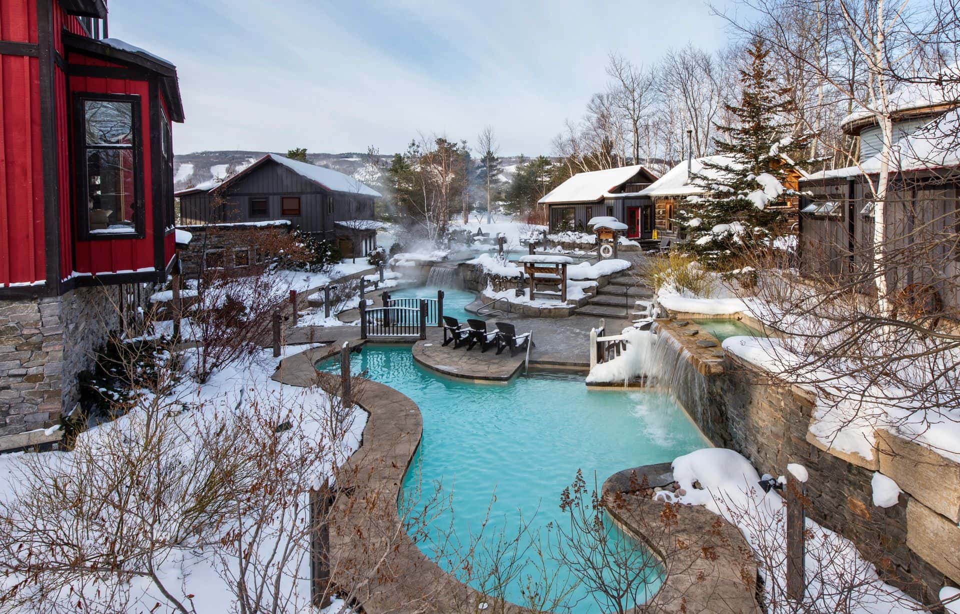 A landscape photo of Scandinave Spa in the winter time. 