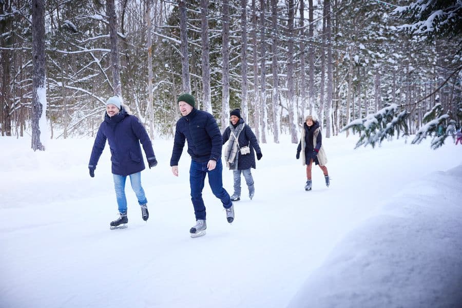 Group of friends gliding together along the Woodview Mountain Top skating loop on a Winter afternoon.