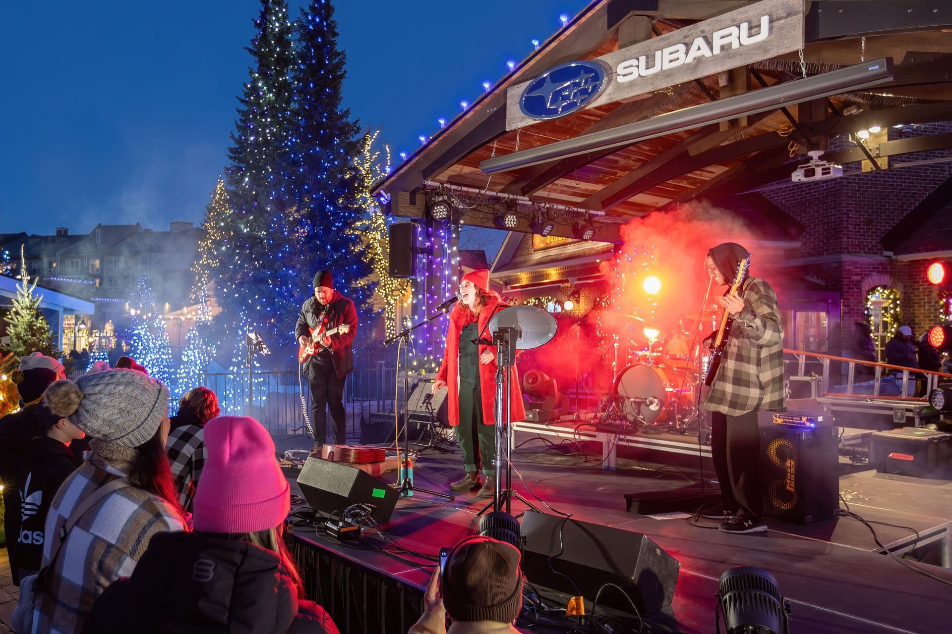 Holiday Magic Opening Weekend Headliner, Holly Clausius, performing live with her band on the Subaru Stage.