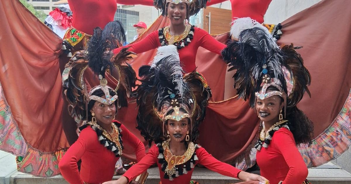A group photo of Caribbean Winterfest performers, Dance Caribe Performing Company, post-performance in Toronto.
