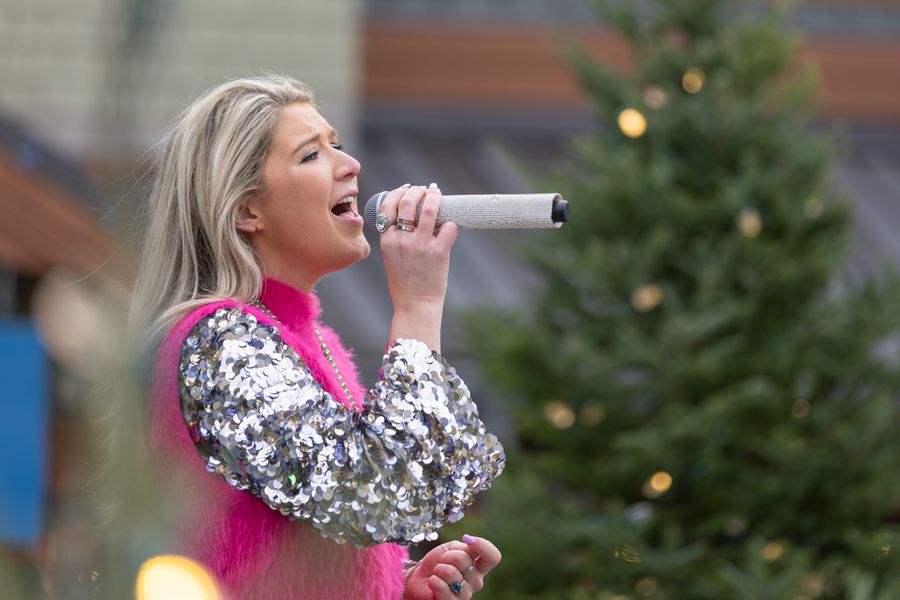 Local singer/songwriter, Emily Power, performing live on the Subaru Stage during Holiday Magic.