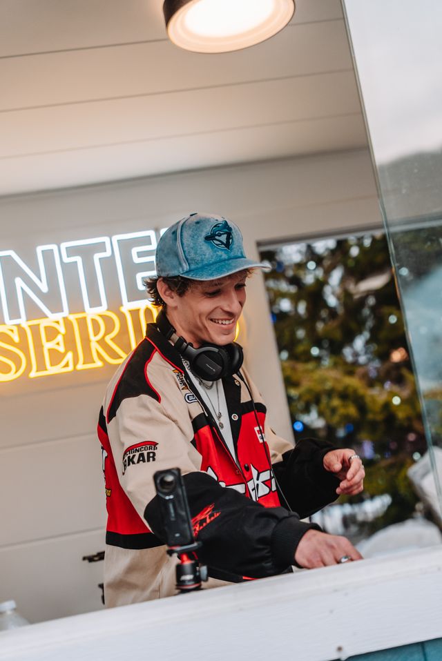 DJ Misha spinning beats live from the Village Events Plaza for the Winter DJ Series